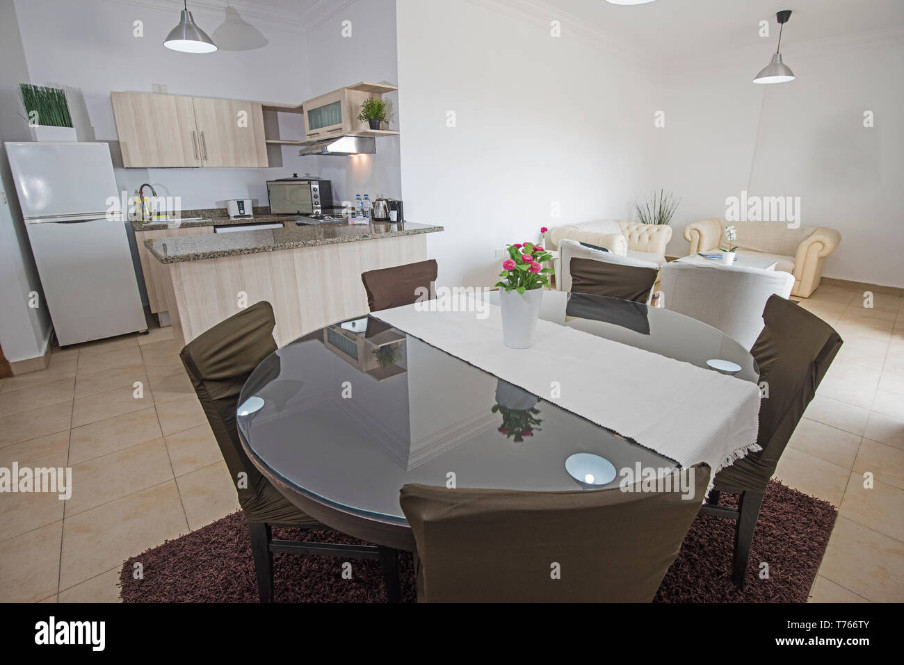 Kitchen and dining area in luxury apartment show home showing interior ...