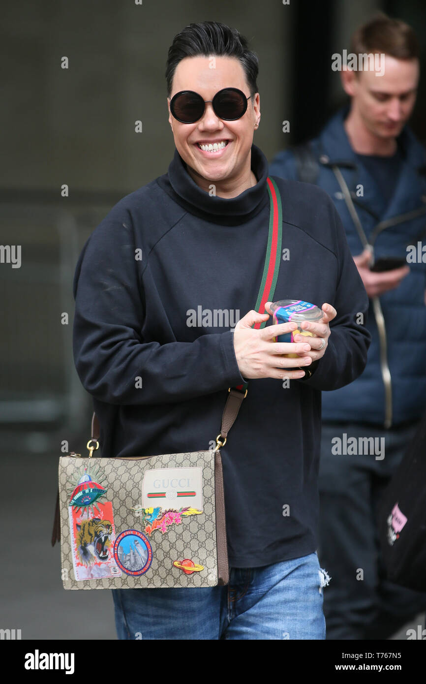 Gok Wan seen with a Gucci man bag as he leaves BBC Radio One