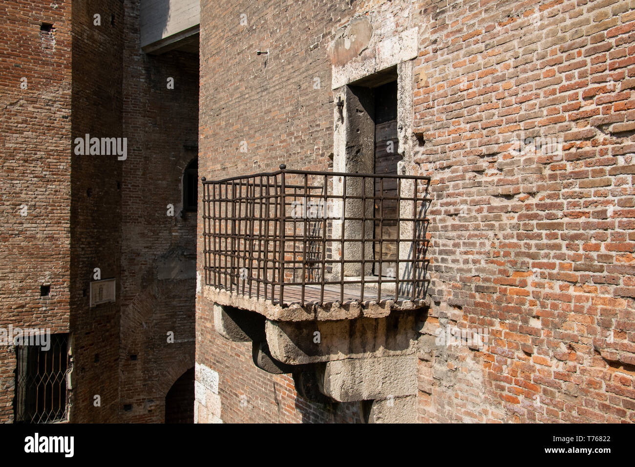 Metal balcony mounted in the wall of the Castelvecchio, Verona, Italy Stock Photo