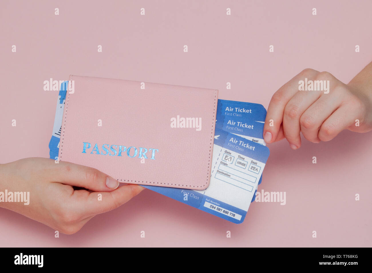 Close up tourist female horizontal hold in hand tickets for plane with