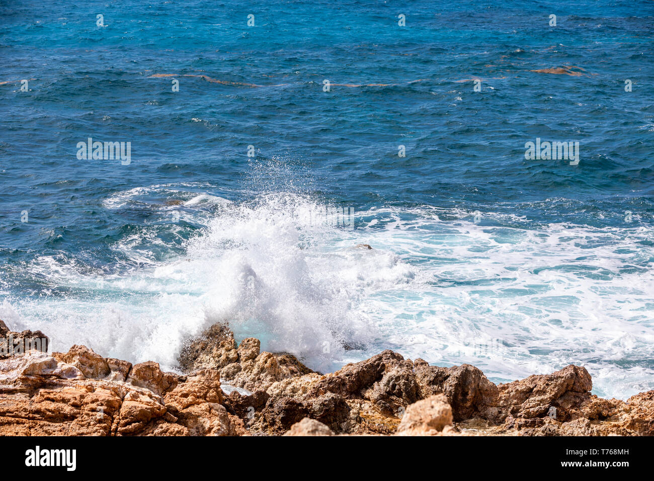 ocean waves crashing on the rocky coast of Grand Fond, St Barts Stock Photo