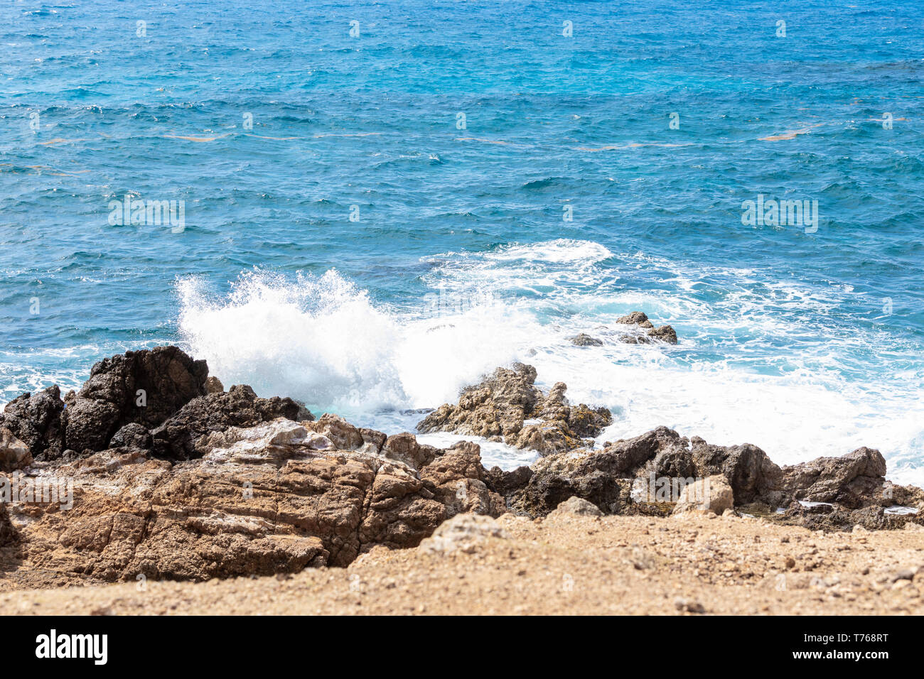 ocean waves crashing on the rocky coast of Grand Fond, St Barts Stock Photo