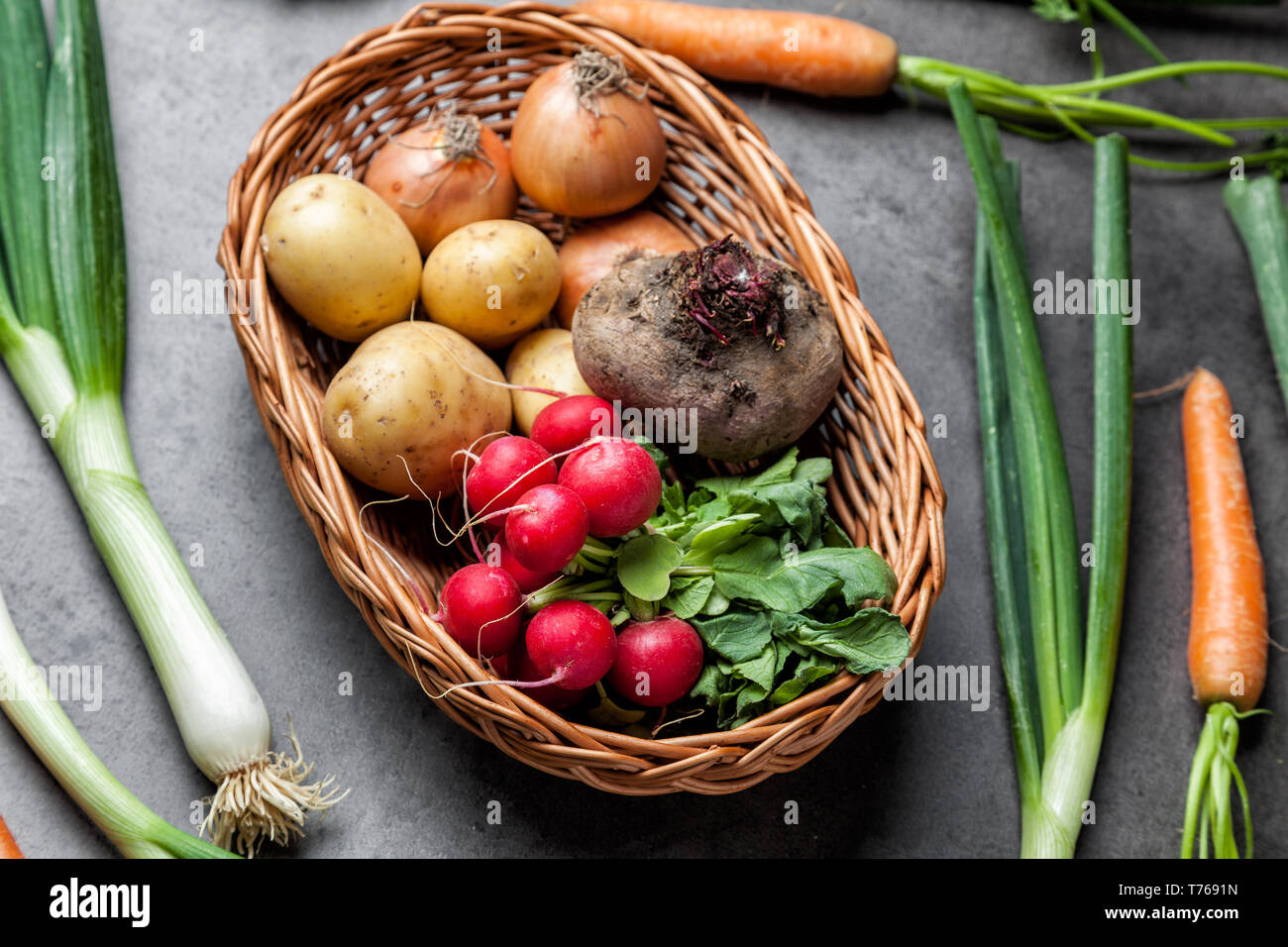 Fresh and healthy organic root vegetables on a rustic background Stock Photo