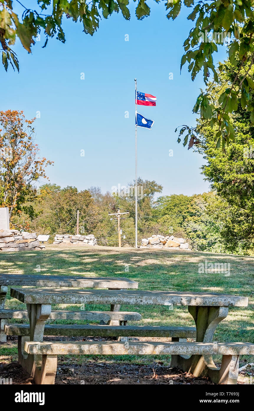 The First National Flag of the Confederacy and the Hardee flag fly near