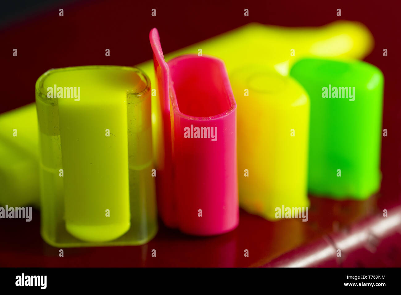 colored highlighter caps caps on black background Stock Photo Alamy