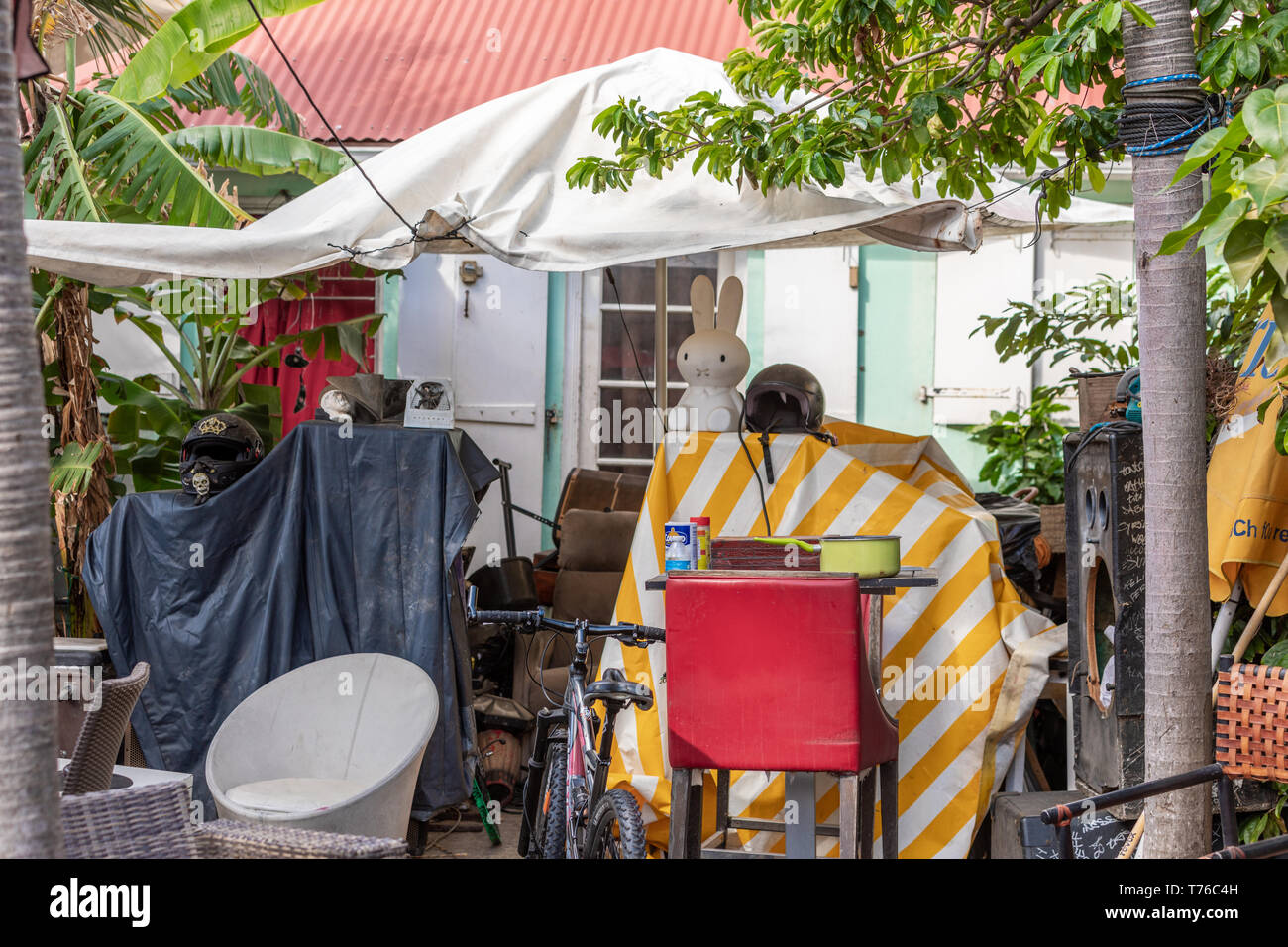 A yard in Gustavia, St Barts that is full of junk Stock Photo