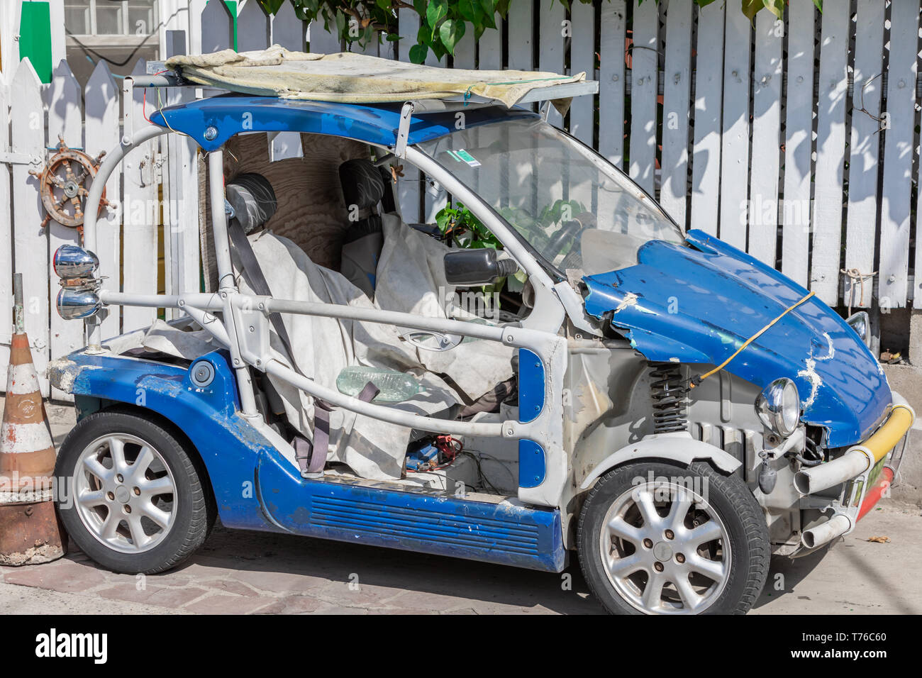 A severely beaten car in Gustavia, St Barts Stock Photo