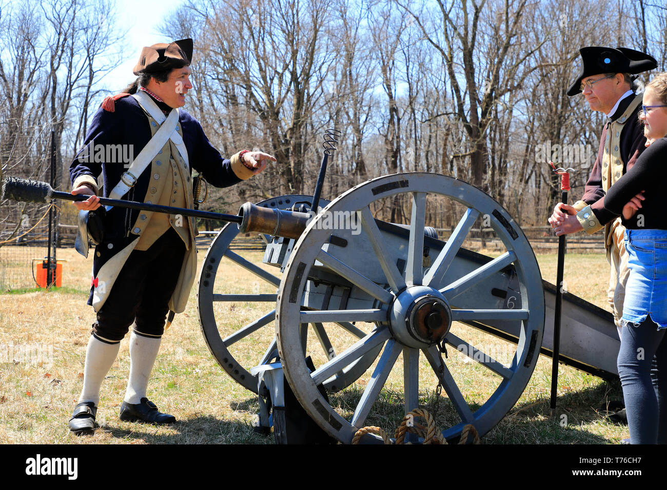 An reenactor of a artilleryman of Continental Army doing artillery demonstration to visitors in Jockey Hollow Historical Park during annual Encampment Stock Photo