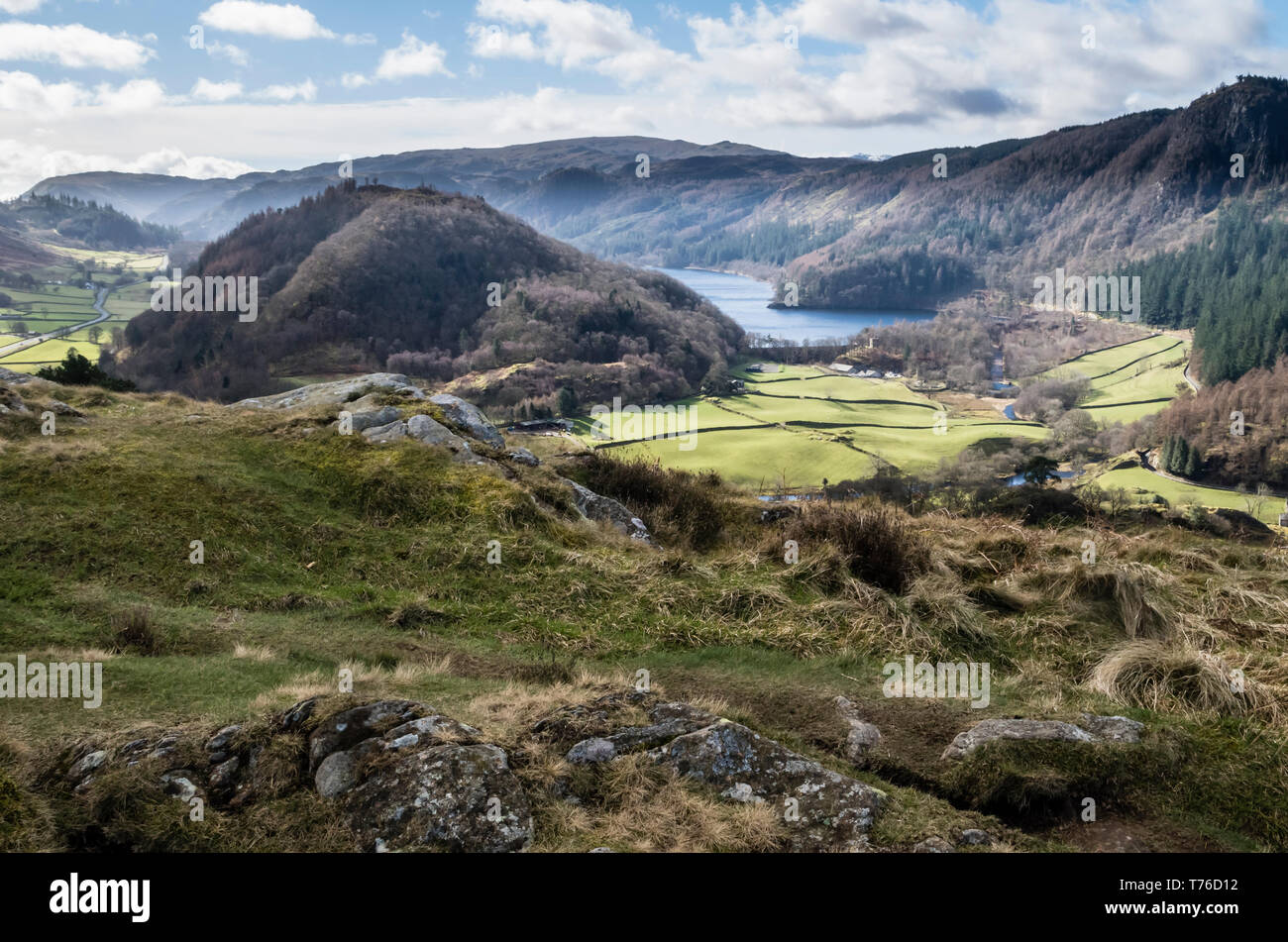 English lake district. A distant view of Thirlmere from High Rigg with a mountainous backdrop on a sunny day. Stock Photo