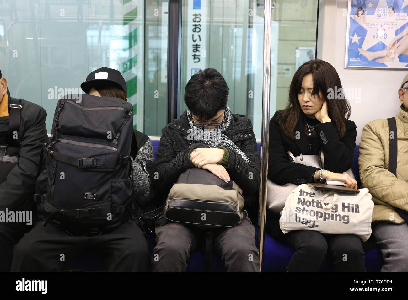 People sleeping on train hi-res stock photography and images - Alamy