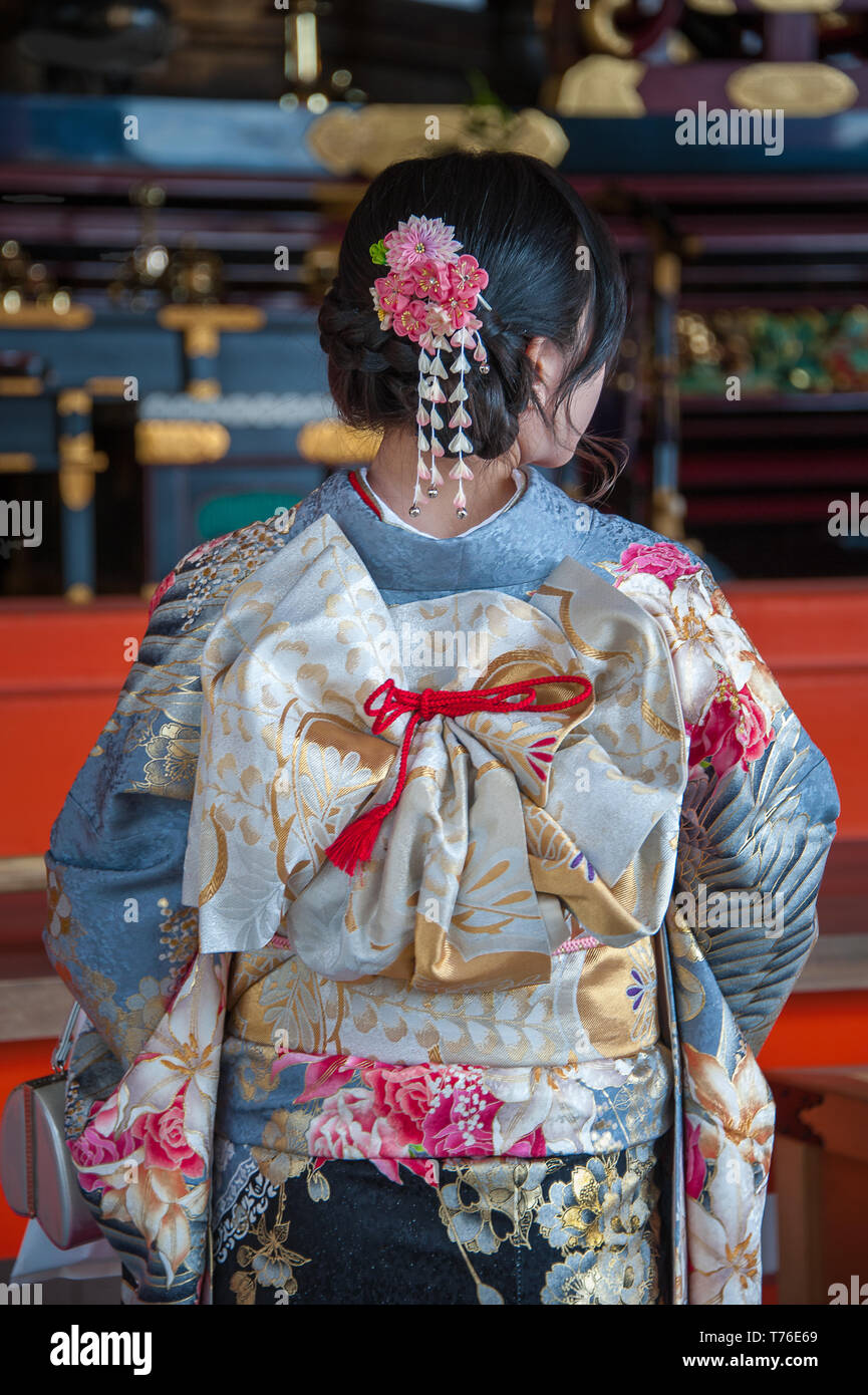 Back view of young woman wearing beautiful Kimono, with intricately tied Obi Sash Stock Photo
