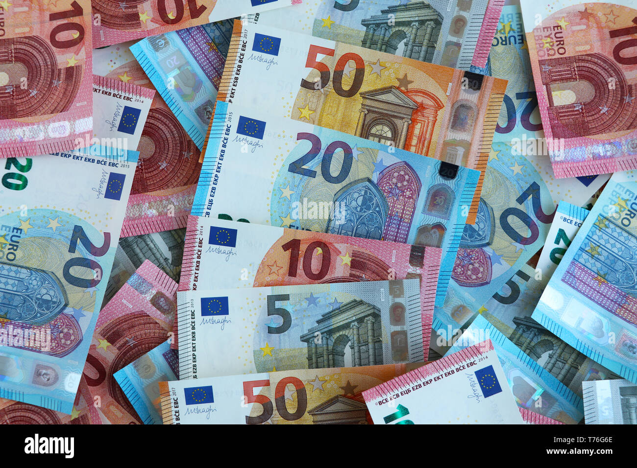 New euro notes of five, ten, twenty and fifty euros randomly piled up Stock Photo