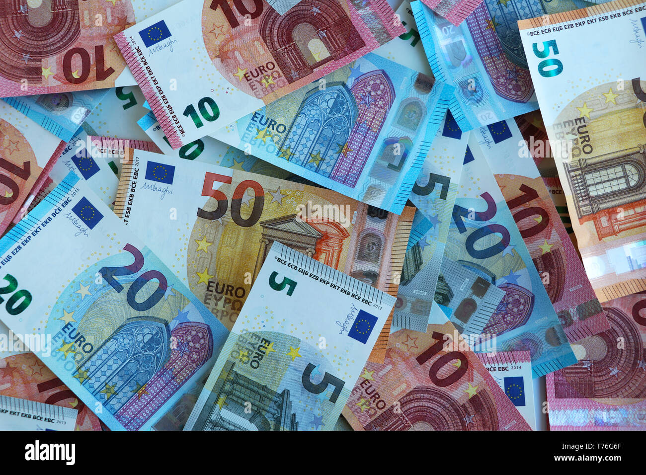 New euro notes of five, ten, twenty and fifty euros randomly piled up Stock Photo