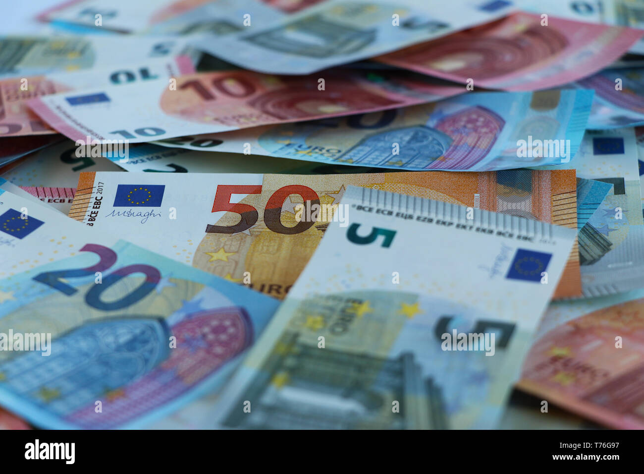 New euro notes of five, ten, twenty and fifty euros randomly piled up Stock Photo