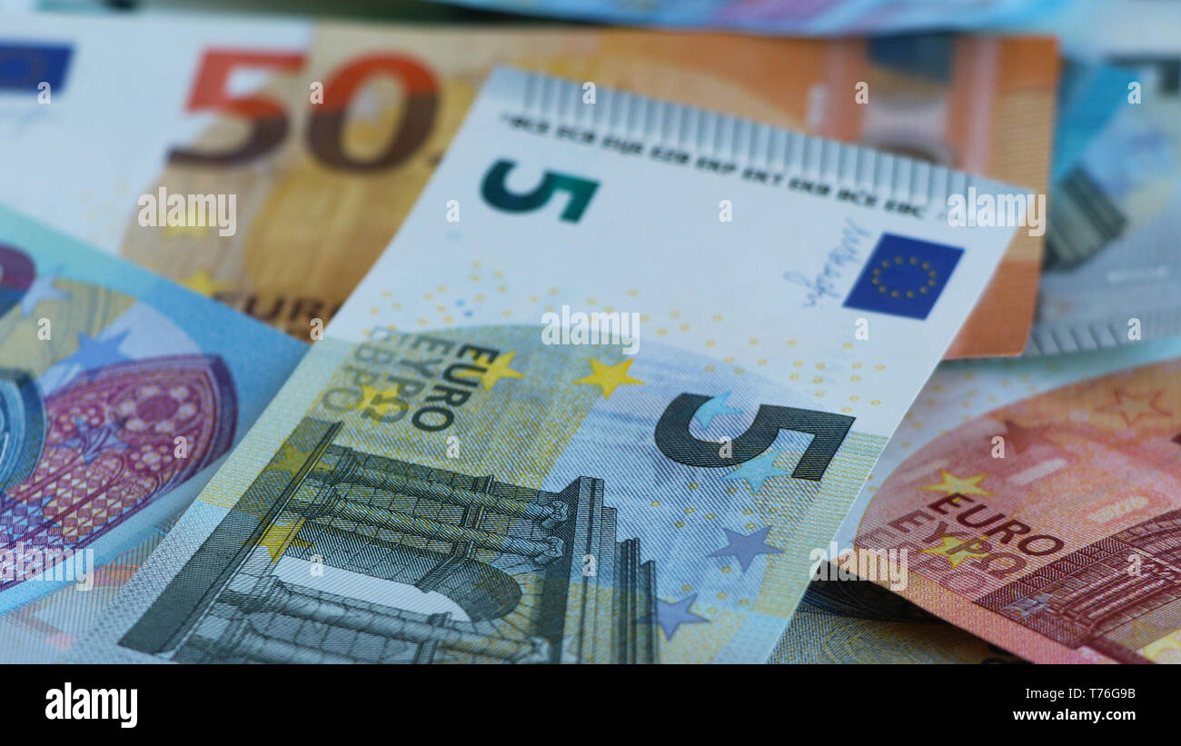 New euro notes of five, ten, twenty and fifty euros randomly piled up Stock Photo