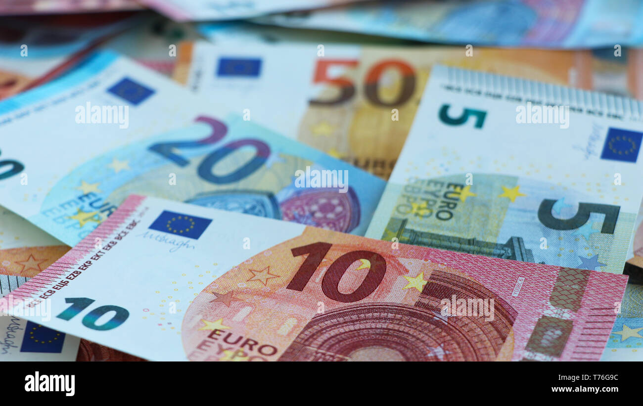 New euro notes of five, ten, twenty and fifty euros randomly piled up Stock Photo