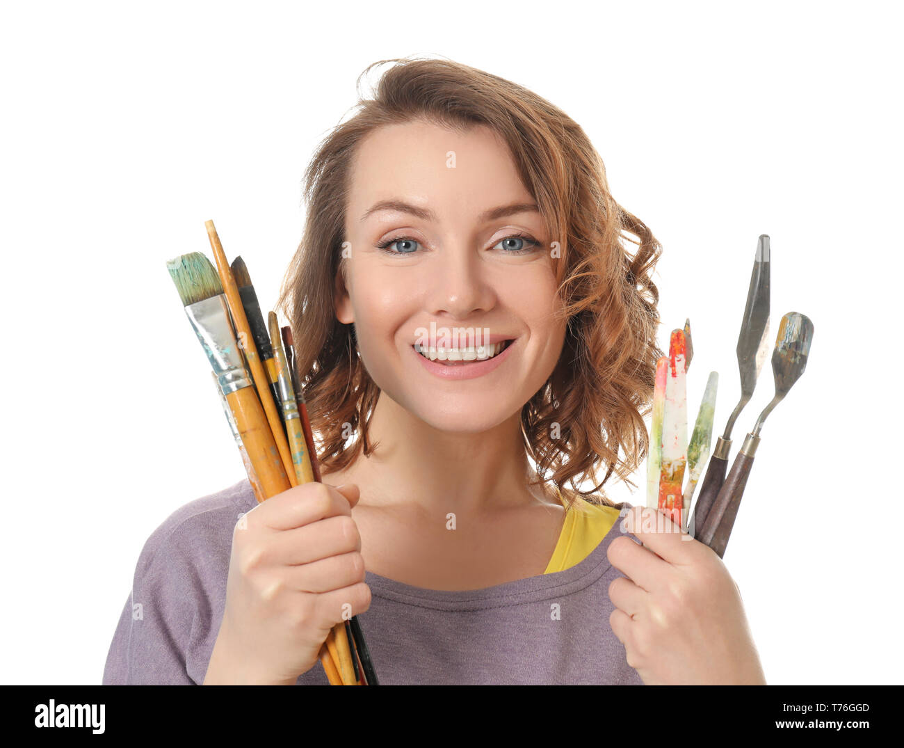 Female artist with paint tools on white background Stock Photo - Alamy