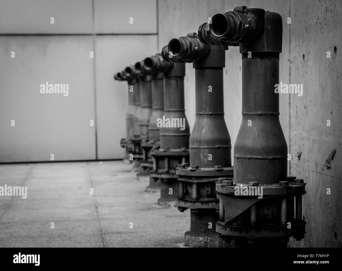 Fire safety pump on cement floor of concrete building. Deluge system of firefighting system