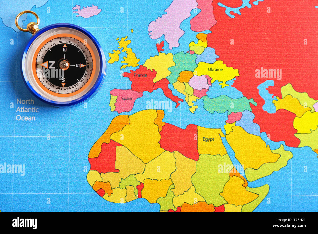 Compass on world map Stock Photo - Alamy