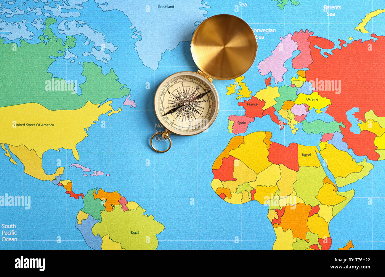 Compass on world map Stock Photo - Alamy