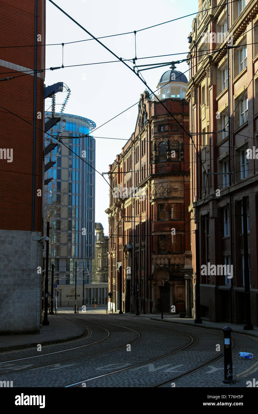 Tram lines, Hanover Building, Balloon Street, leading down to Corporation Street, Manchester, UK Stock Photo