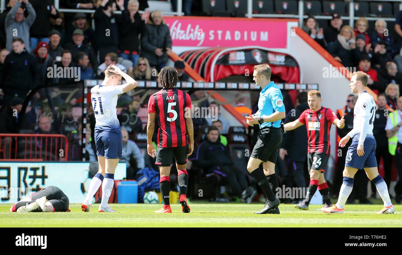 Tottenham Hotspur's Juan Foyth (second left) reacts after being shown red card by referee Craig Pawson after a challenge of AFC Bournemouth's Jack Simpson (left) during the Premier League match at