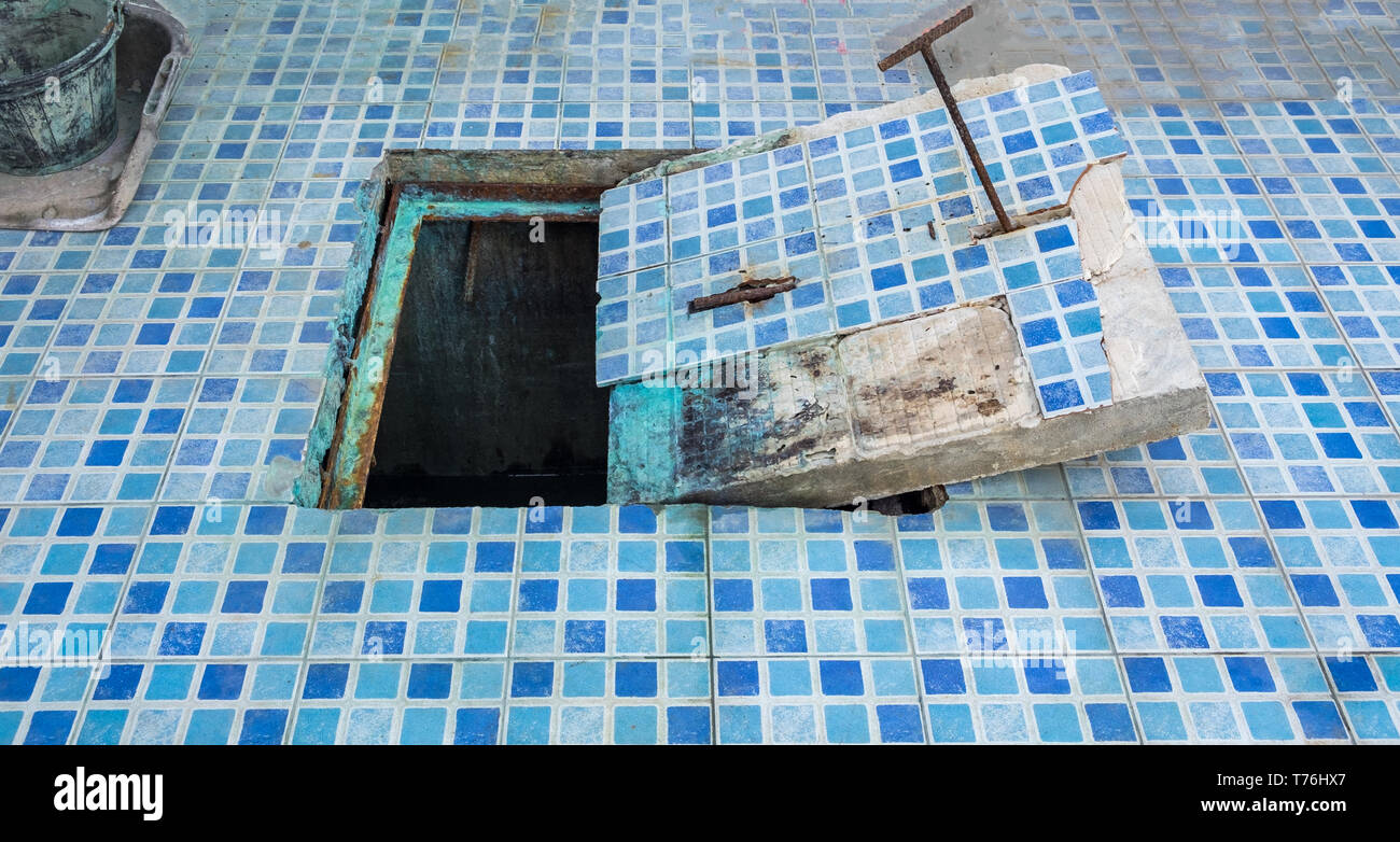 Cap drain decay industry in pool area Stock Photo
