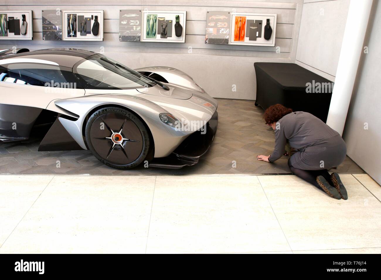 Tanya Gledhill, editor of Cotswold Life Business and Professional, and former motoring journalist, taking a low down look at the Aston Martin Valkyrie Stock Photo
