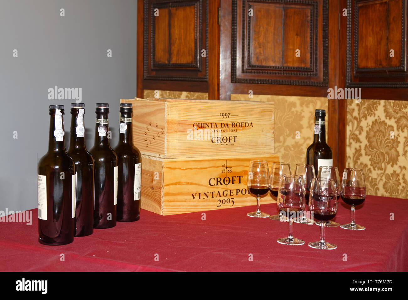 wine display, bottles, glasses, wood boxes, winery, alcoholic beverage