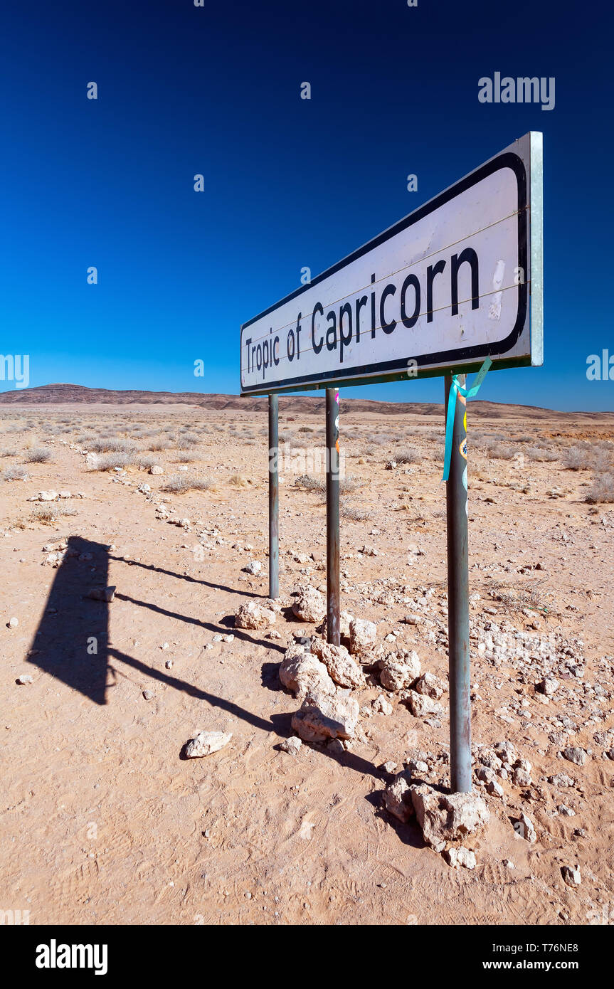 A sign marking the Tropic of Capricorn as it passes through Namibia desert. Stock Photo