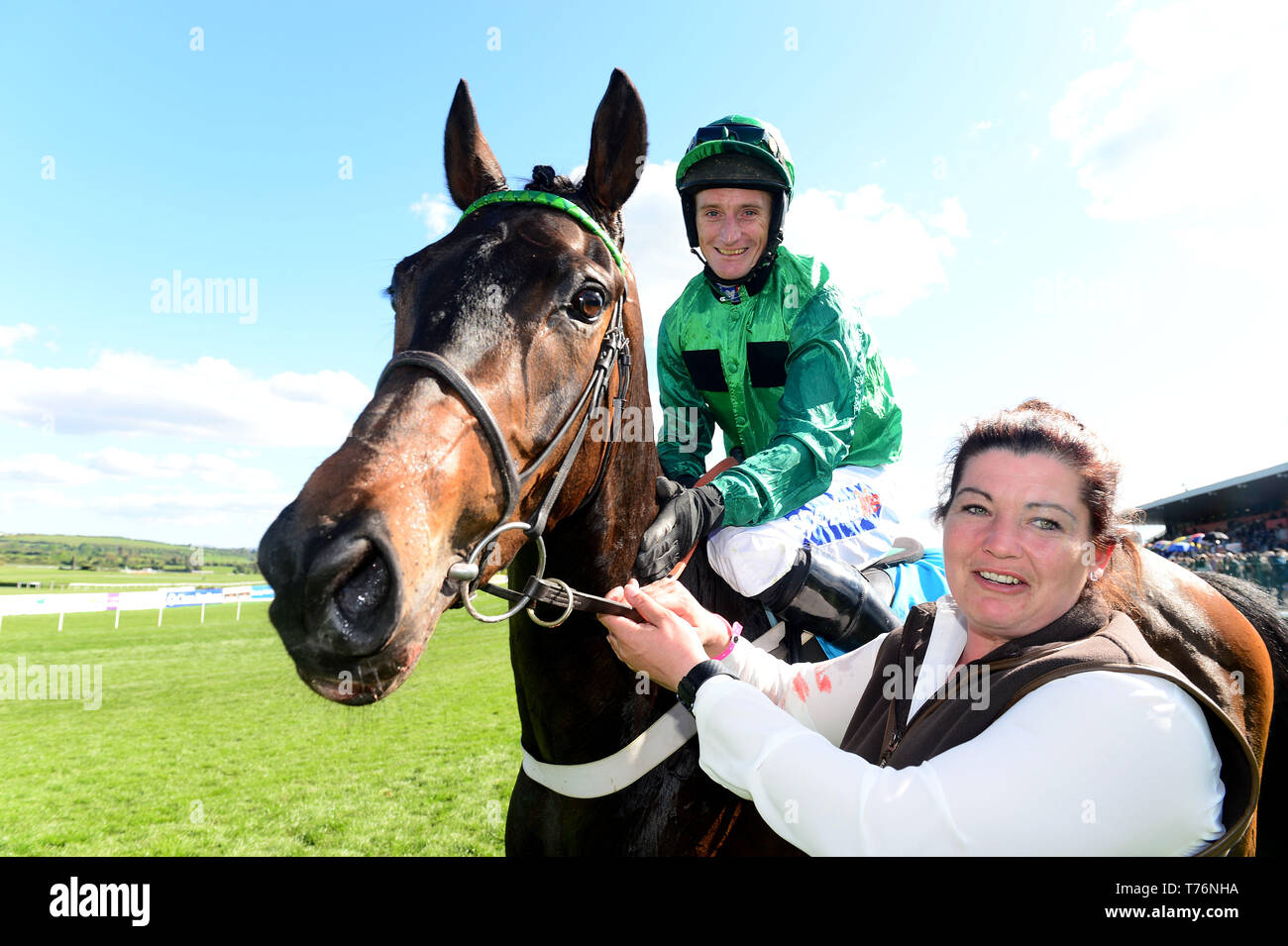 Fusil Raffles and Daryl Jacob with groom Sarah Steele after winning the ES Champion Four Year Old Hurdle during day five of the Punchestown Festival at Punchestown Racecourse, County Kildare, Ireland. Stock Photo