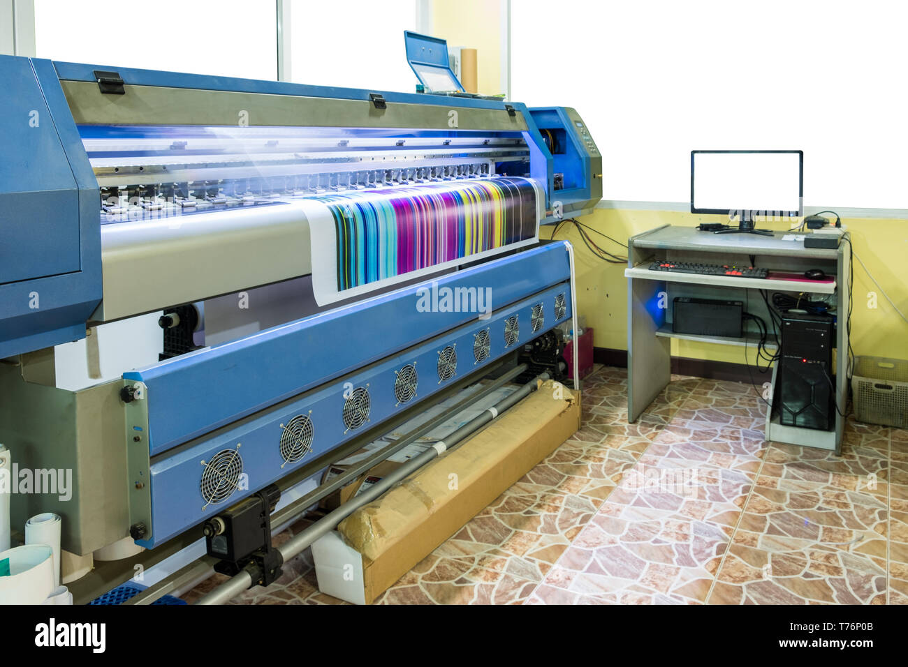 Large inkjet printer working multicolor cmyk on vinyl banner with computer  control in printing plant Stock Photo - Alamy