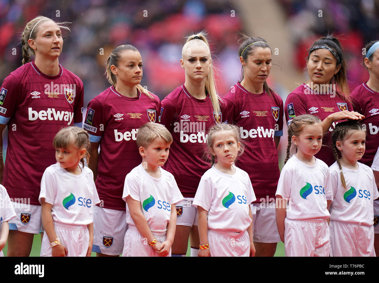 West Ham Ladies' Alisha Lehmann (centre) lines up with her team ...