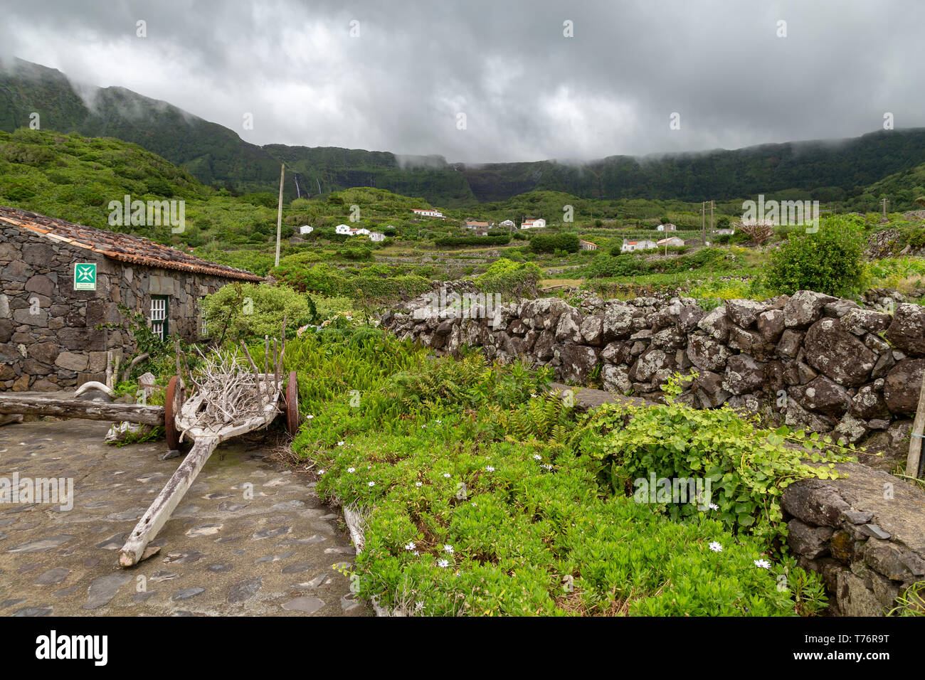 Old rock wall and house in Fajazinha on Flores island in the Azores. Stock Photo