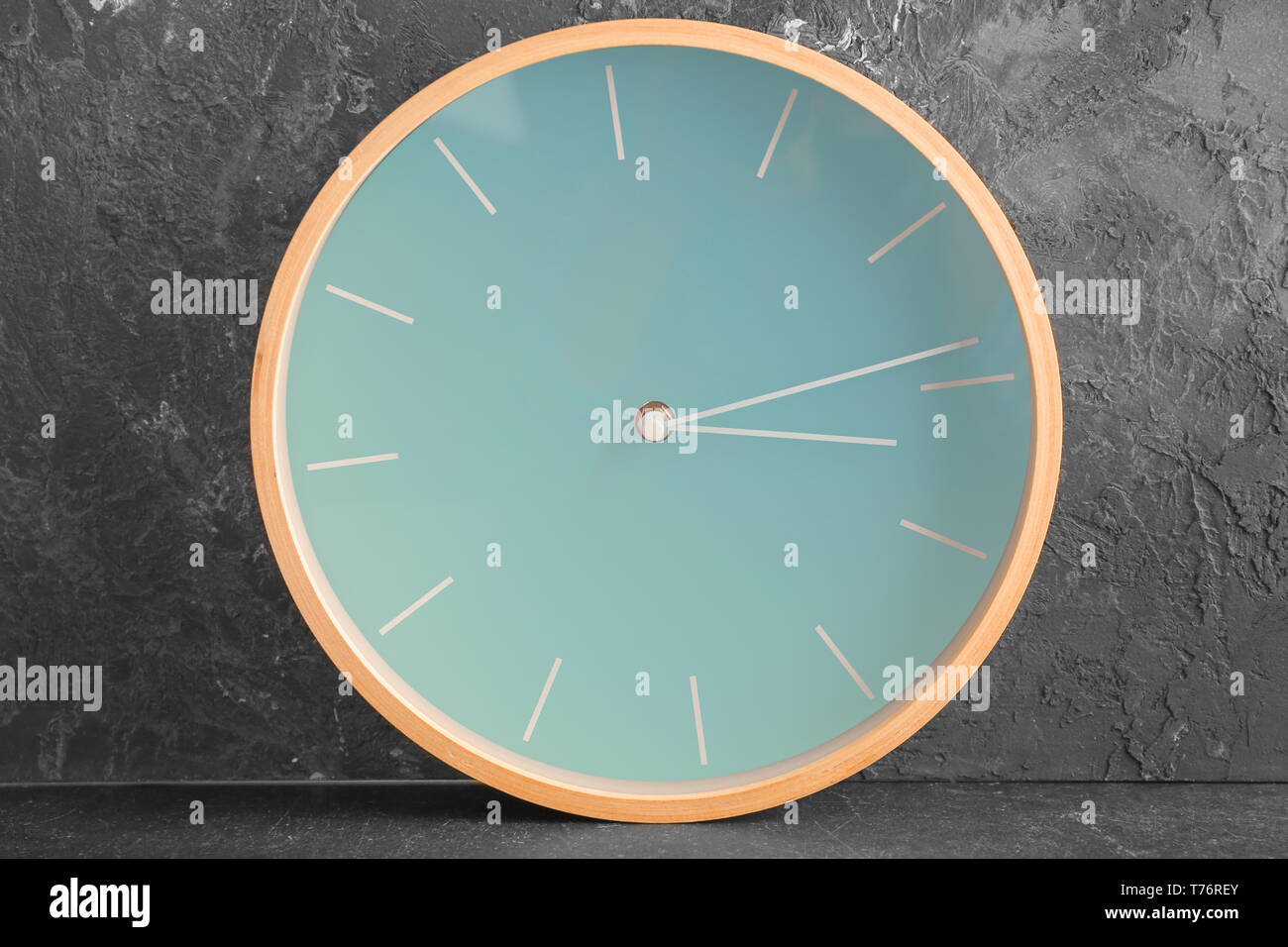 Clock on grey background. Time management concept Stock Photo - Alamy