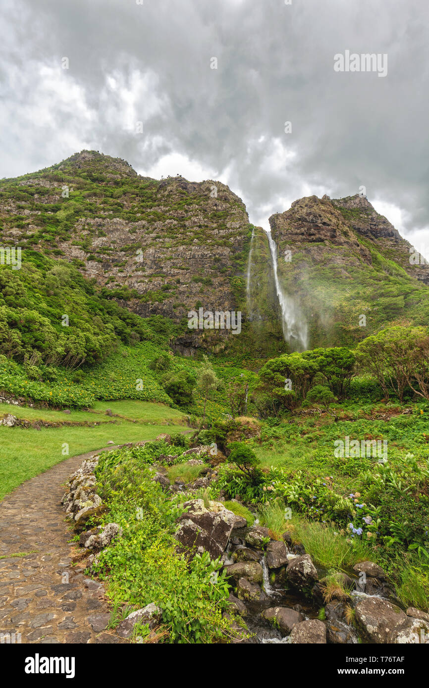 Portrait view of the small stream below the Cascata do Poco do Bacalhau waterfall near Faja Portrait view of the small stream below the Cascata do Poco do Bacalhau waterfall near Faja