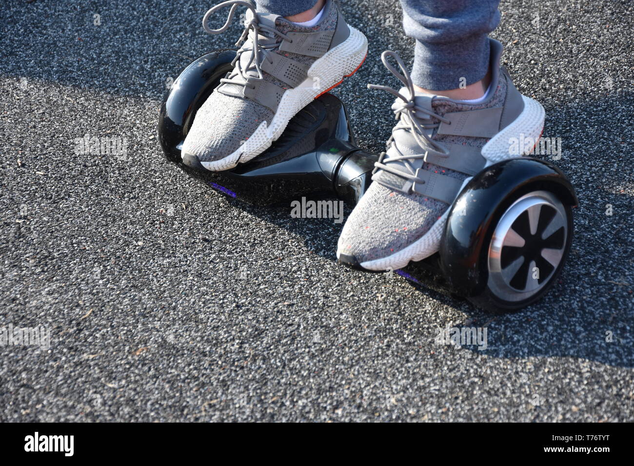 young man riding on the Hoverboard in the park Stock Photo - Alamy