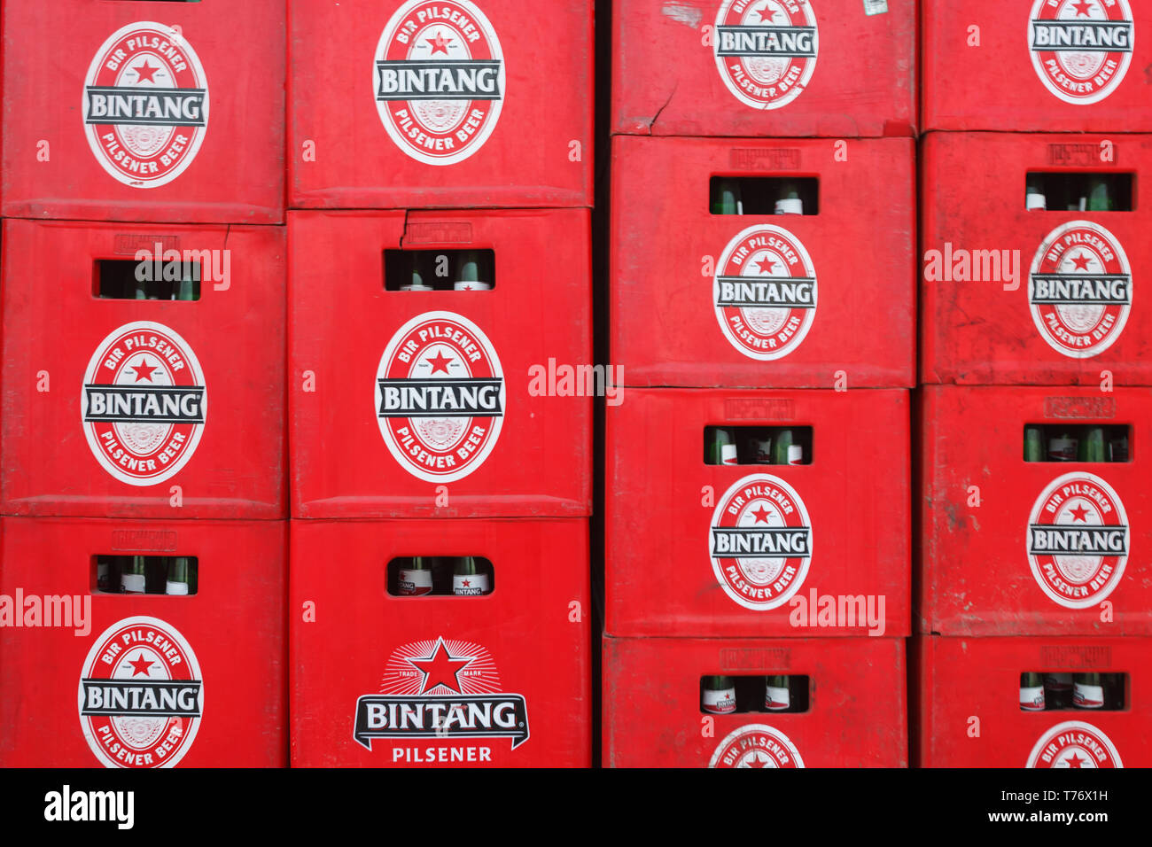 Closeup of red stacked cases of bottles of  Bitang beer Stock Photo