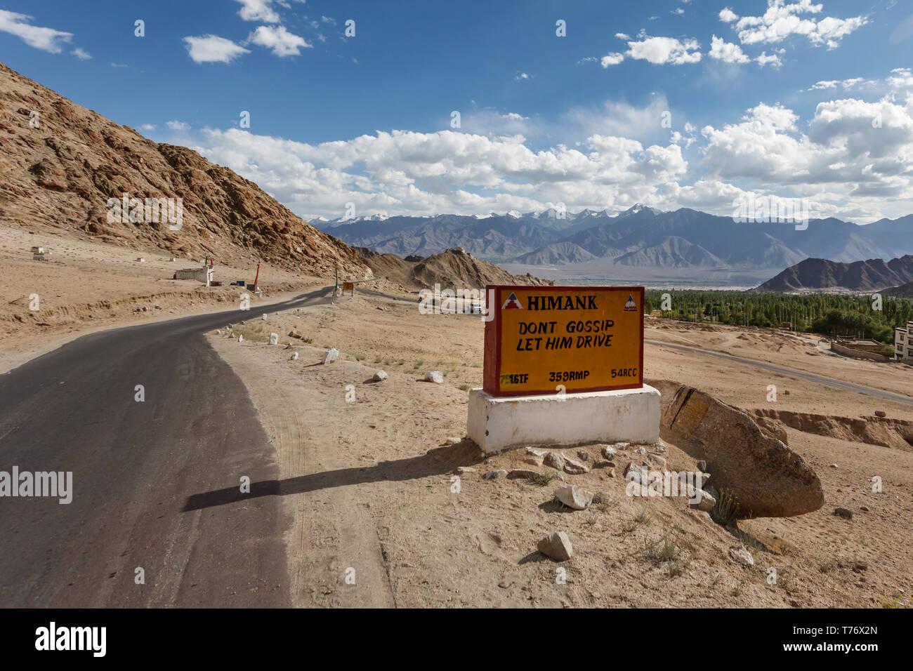 Closeup of traffic sign on Jammu and Kashmir mountain pass road reminding people to be careful and pay attention to driving Stock Photo