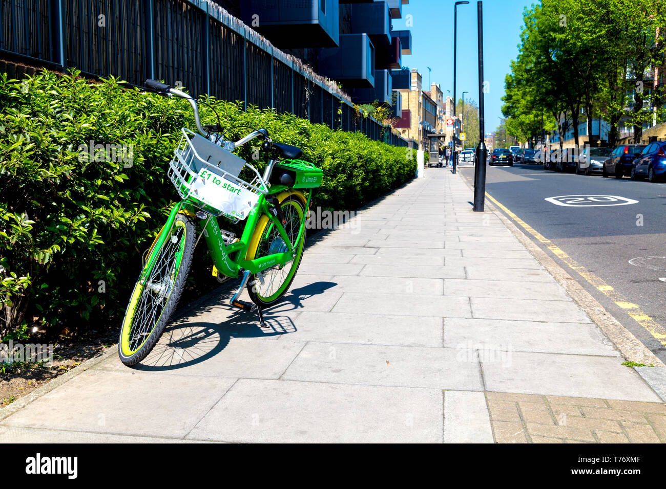 A dockless Lime-E rental electric bicycle standing on the street in East London, UK Stock Photo