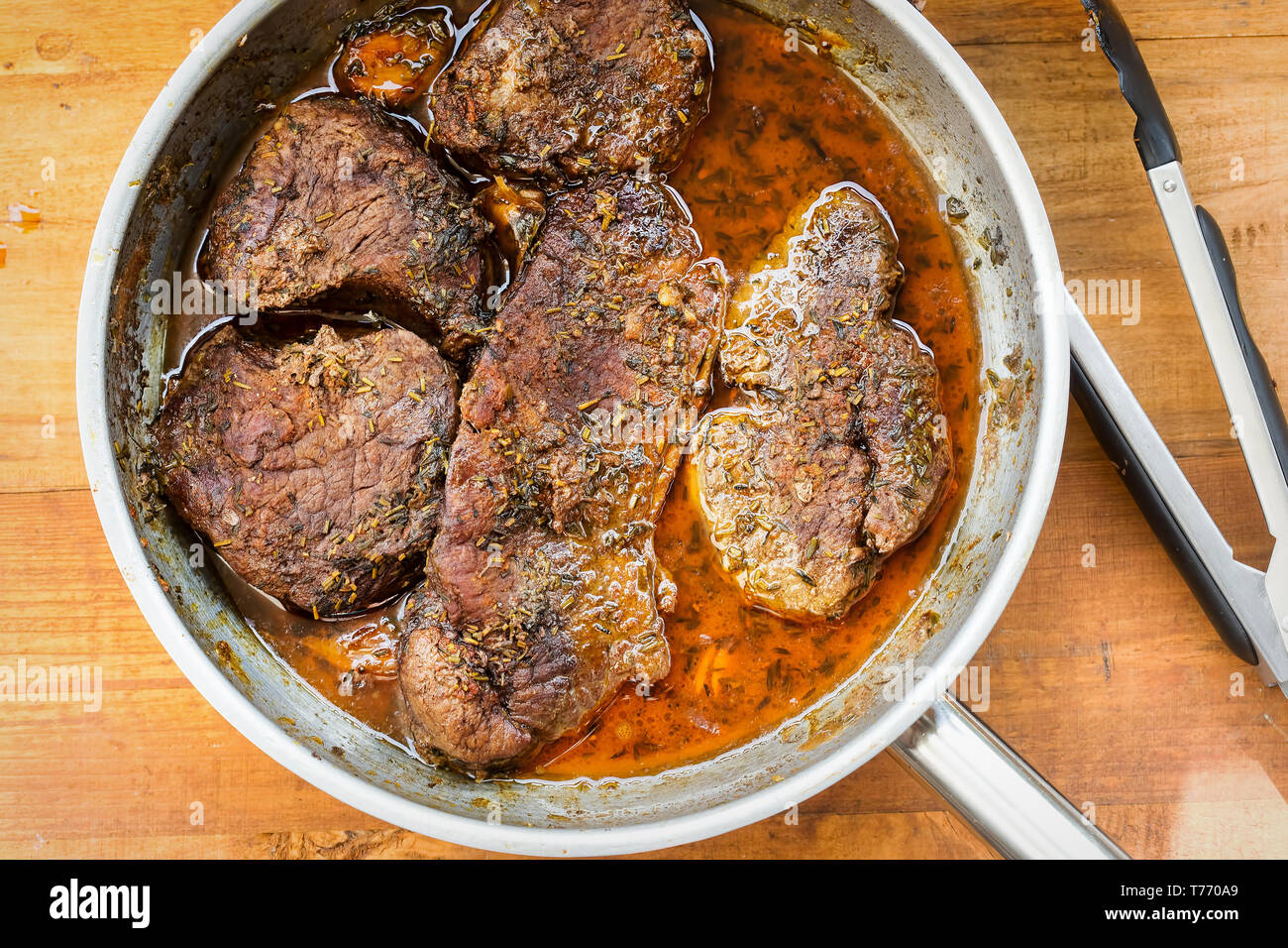 Braised beef steak in red wine Stock Photo Alamy
