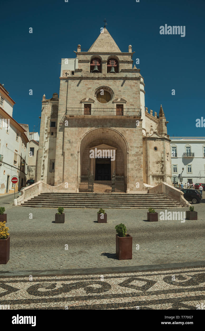 Our Lady of the Assumption Cathedral facade and old buildings on a deserted square at Elvas. A gracious city on the easternmost frontier of Portugal. Stock Photo