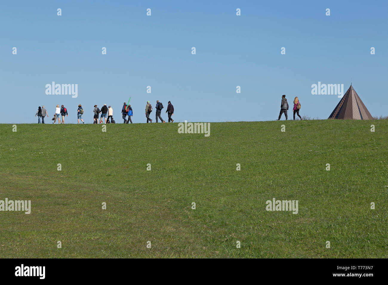 people walking on the dike, Spiekeroog Island, East Friesland, Lower Saxony, Germany Stock Photo