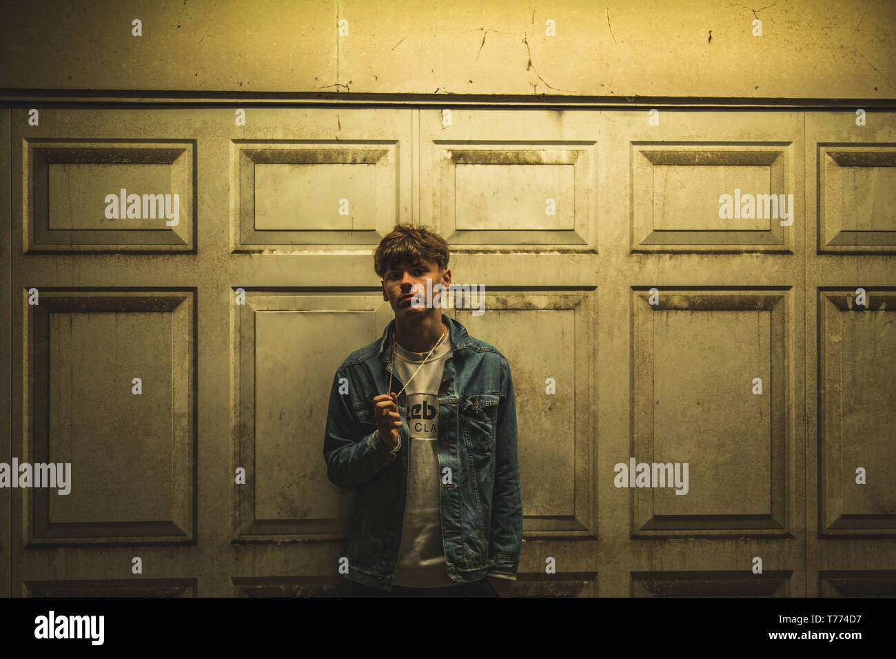 Young stylist model with denim jacket Stock Photo