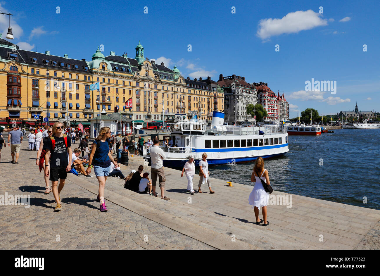 Stockholm, Sweden - July 12, 2018: The Nybroplan area with people in front of the public transportation ferry. Stock Photo