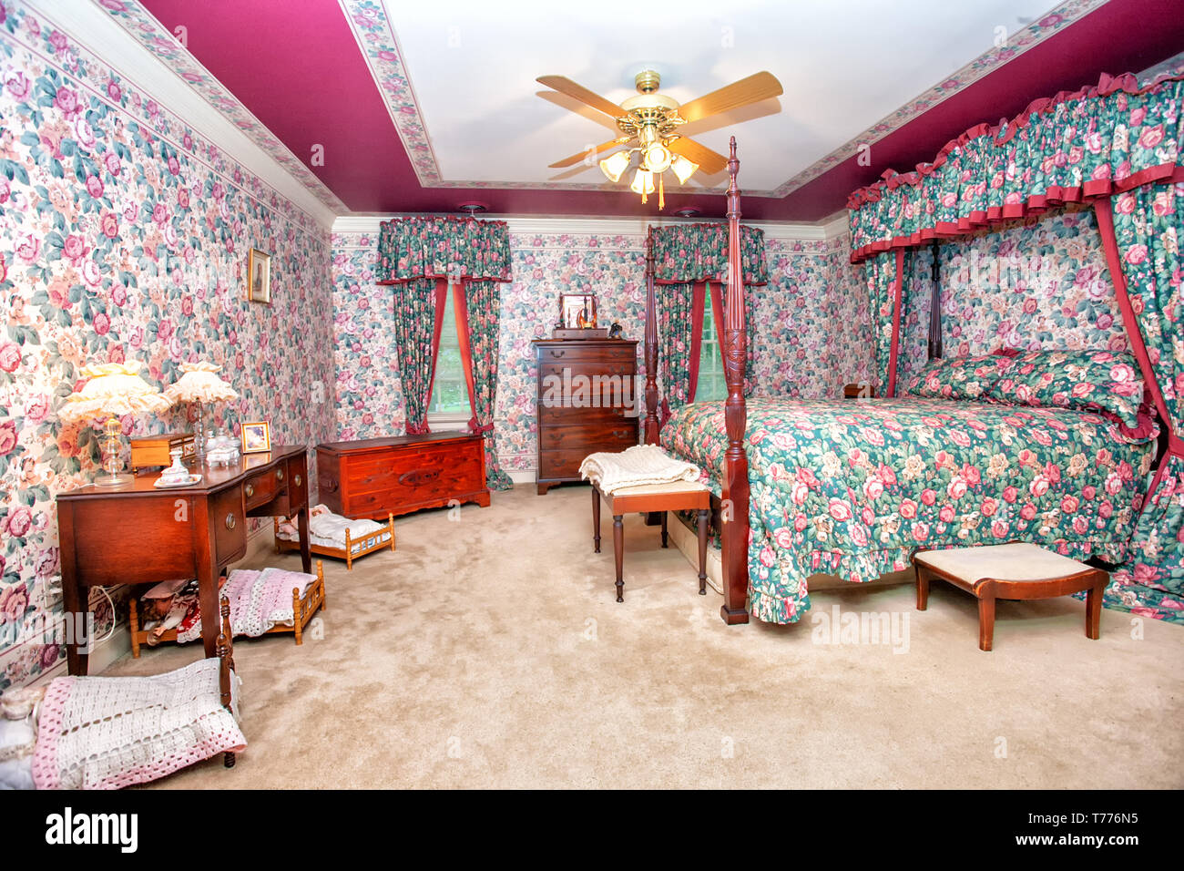 Overly decorated bedroom in a rose motif. Stock Photo