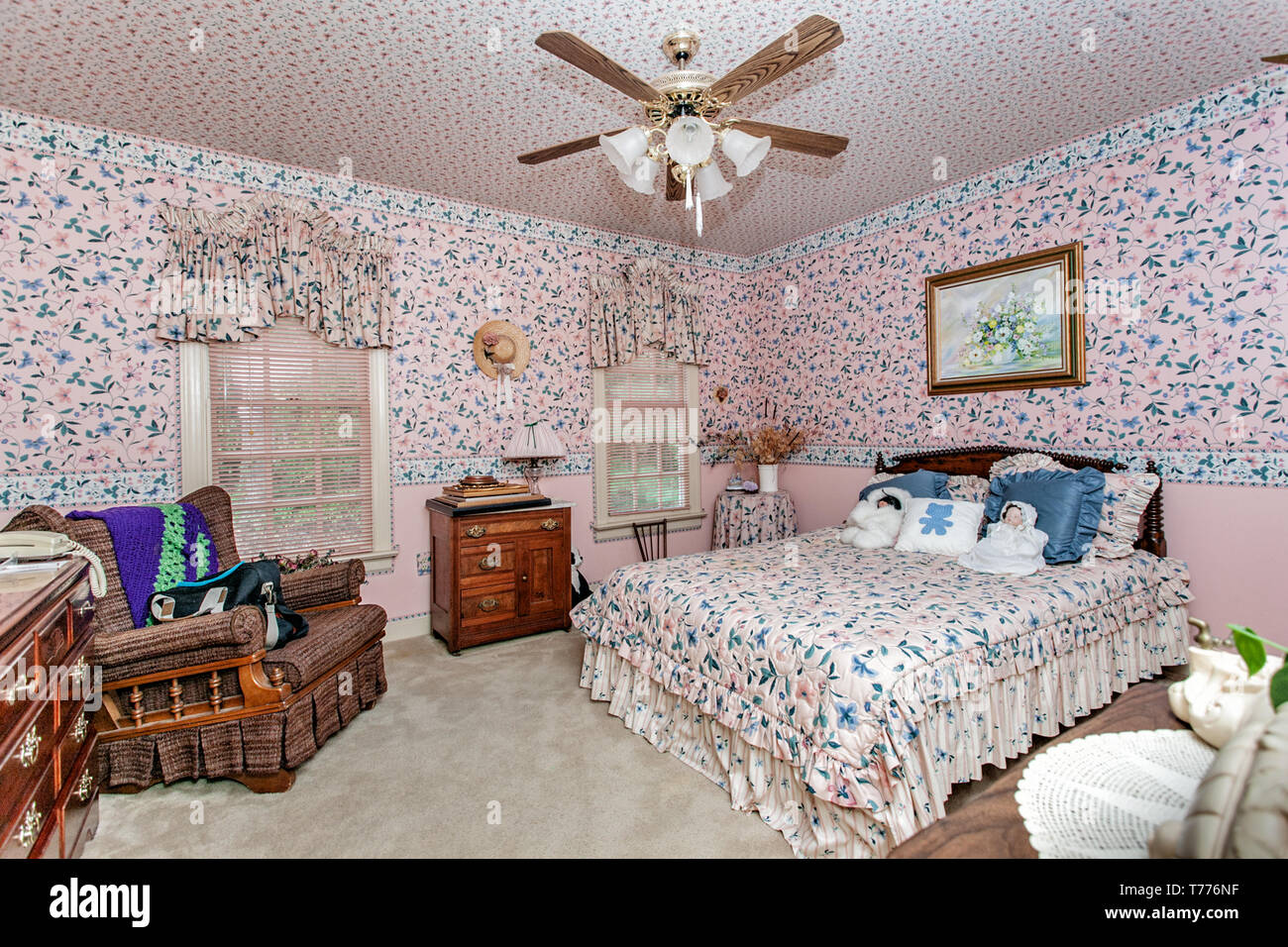 Overly decorated bedroom in a rose motif. Stock Photo