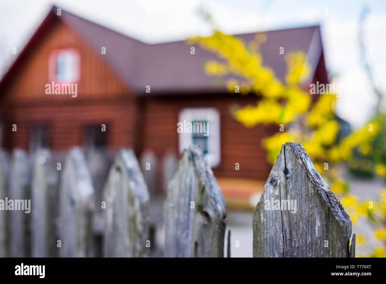 Traditional village house with wooden fence at russian rural ...