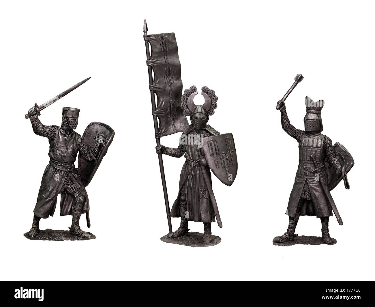 Tin soldiers  medieval knights. Set of 3 knights. Knight with banner. Stock Photo