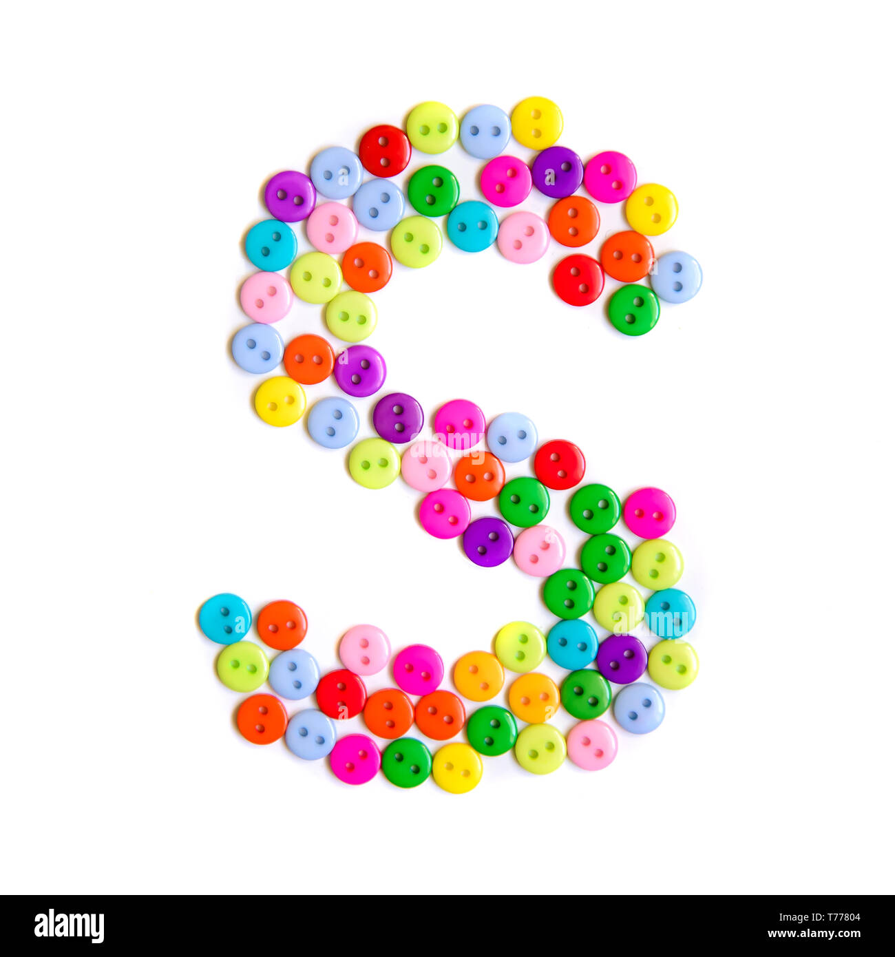 Letter S of the English alphabet from a group of colorful small buttons on a white background Stock Photo